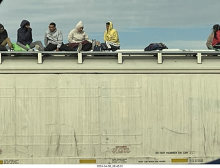 Torreon - Mexicans riding the tops of freight-train cars