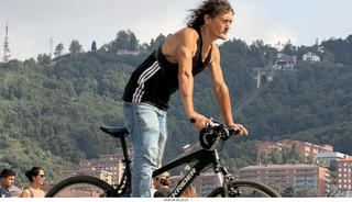 38 a2y. Spain - Bilbao - walking tour - bicyclist blocking view of funicular